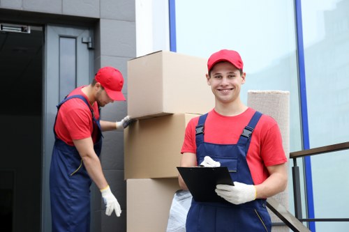 Storage team sorting cardboard and recyclable packing materials on site