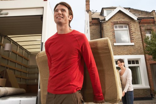 Professional man and van helping with a house move in Boundsgreen