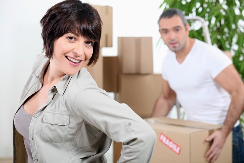 Commercial movers transporting office furniture during a Boundsgreen relocation